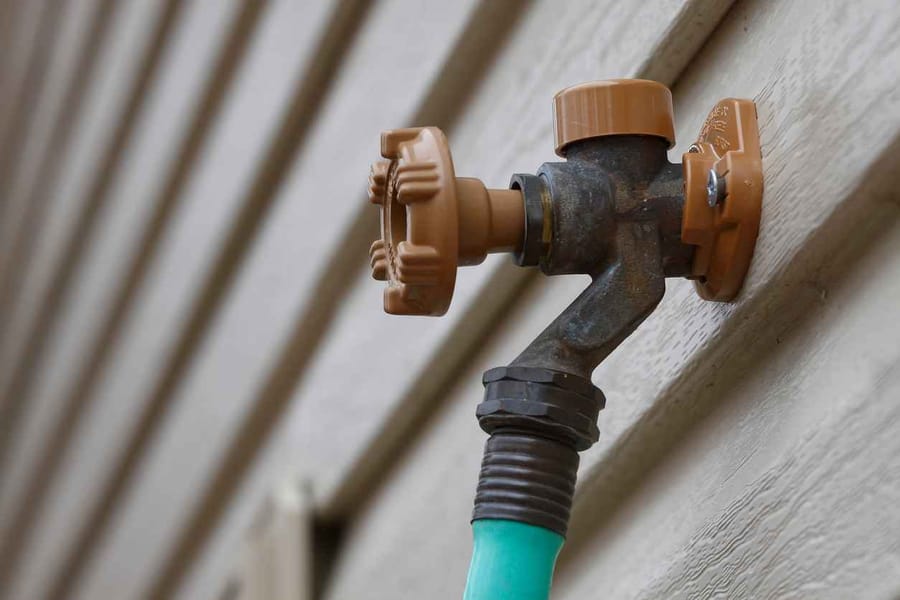 outdoor-faucet-2 - Affordable Plumbing Outdoor faucet on the side of a residential home
